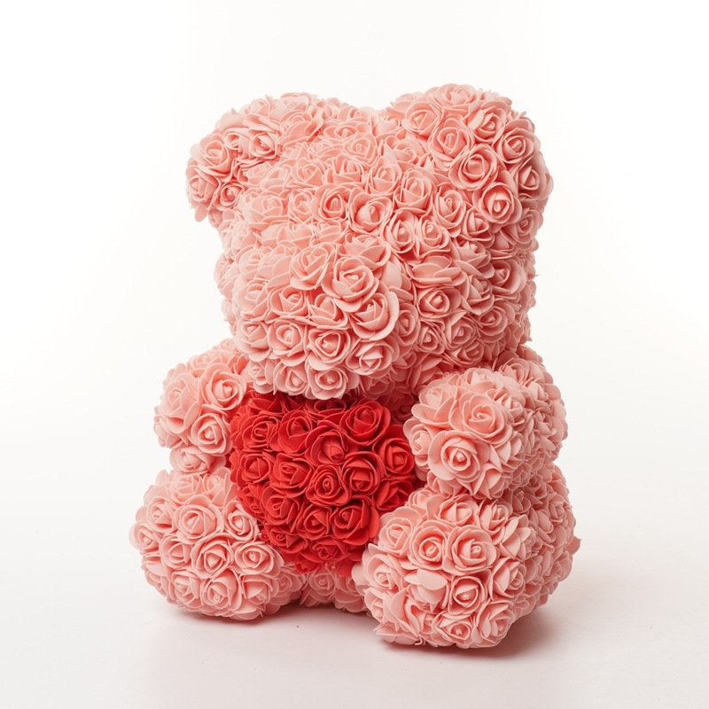 Peach pink rose bear holding a red heart