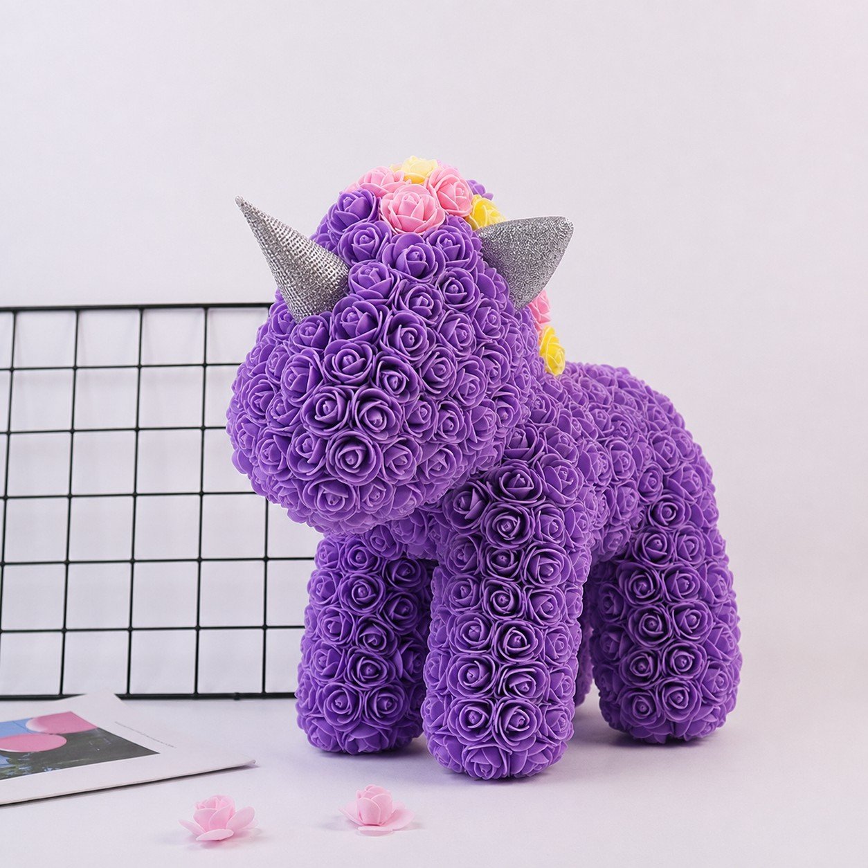 Close-up detail of purple classic rose unicorn horn ears and rose petals